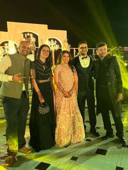 Posing with the happy couple and friends. It's all about celebrating together, and I ensure my clients and their families look picture-perfect for these group photos.