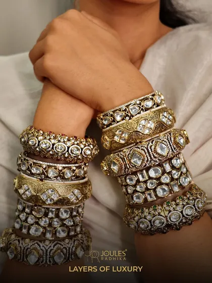 Layers of luxury for your wrist. I believe in the power of a curated stack, mixing different textures and designs to create a look that is uniquely yours. This image showcases a variety of our polki and gold-plated bangles.