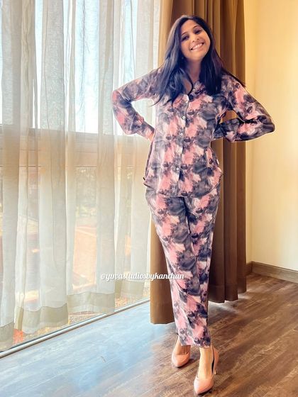 Our stylish printed fine crepe co-ords in a pink and grey abstract print. The pants have two pockets, and the style can be customized to your needs.