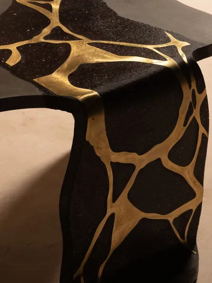 Our coral center table, featuring mesmerizing brass inlay and unique concrete shapes. This piece is designed for a beautiful art space, bringing an elegant and unique presence.