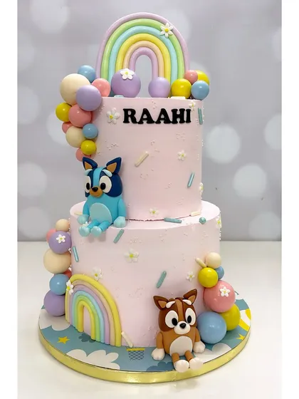 I love making kids' parties extra special. This two-tier Bluey cake features hand-modelled characters and colorful details, all made with tasty cream frosting that children actually enjoy eating.