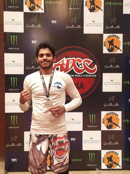 A proud moment in front of the official ADCC India backdrop after winning the silver medal. This competition tests your submission skills against the very best.