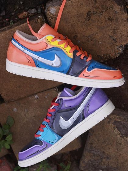 A top-down view of the Naruto and Sasuke custom Jordans.