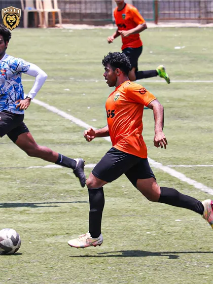 An SG5 player running with the ball at pace, putting the opposition's defense on the back foot.