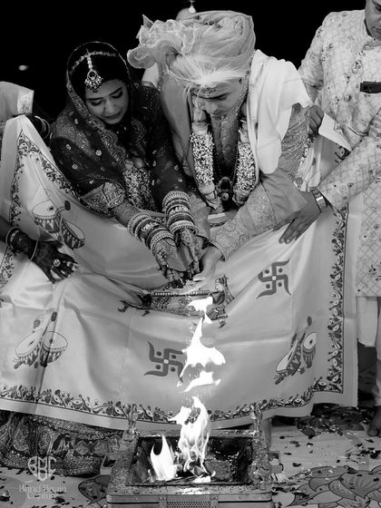 A powerful black and white shot of the havan, the sacred fire at the heart of a Hindu wedding. We use artistic angles to emphasize the importance of these traditions.