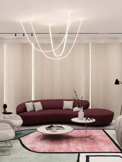 This render shows the interplay of curves and color in the Gulecha Residence. A deep red curved sofa is set against a gently undulating wall, with a modern, free-form chandelier above. The design creates a space that feels both dynamic and enveloping.