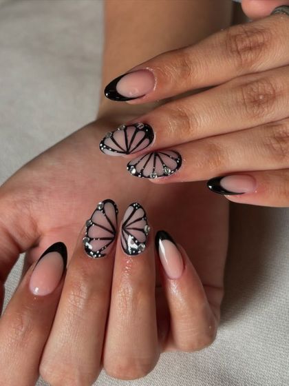 A full view of the stunning butterfly wing French manicure. This is a perfect example of how we can turn your nails into a piece of art.