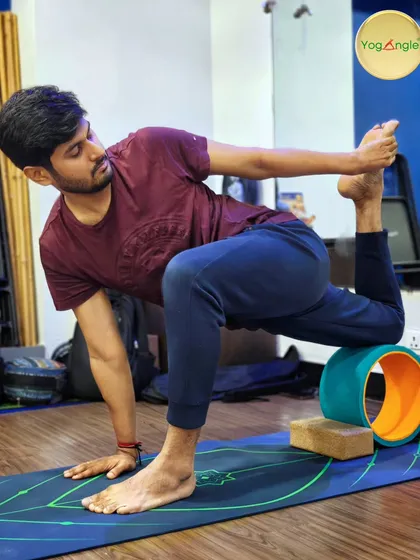 A yoga wheel can add a new dimension to twisting poses. This supported twist helps to release tension in the spine and hips while challenging balance and focus.