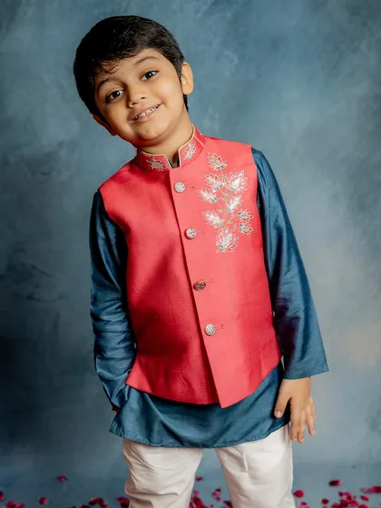 Carefully designed and exquisitely detailed. This vibrant red Bundi with delicate silver lotus embroidery is the ultimate choice for a festive occasion, offering style that is built to last.