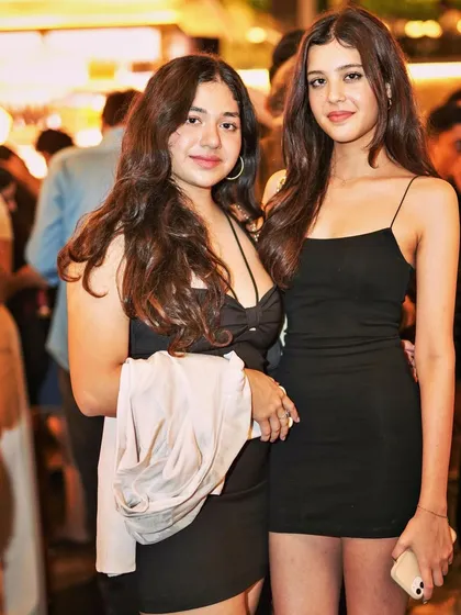 Guests dressed in black, enjoying the sophisticated vibe of Pangeo.