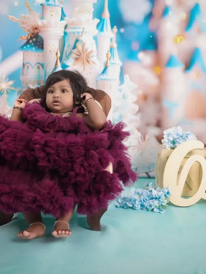 Is your little one a fan of fairy tales? We bring their dreams to life with elaborate themed shoots, like this magical 'Frozen' castle setup. Our studio has a wide range of themes to make their first birthday truly special.