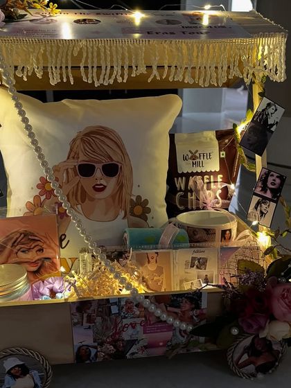 The full Taylor Swift cart hamper, lit up with fairy lights. It's a stunning display piece and the ultimate gift for a true fan.