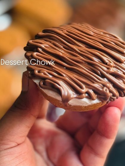 A mini Nutella cheesecake, with a creamy base and a generous topping of Nutella, drizzled for a beautiful finish. It's a favorite among chocolate lovers.