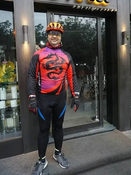 A member in a striking dragon-themed jersey. We encourage our members to show off their unique style.