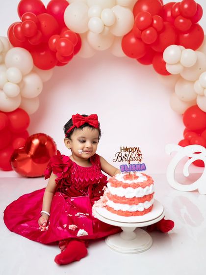 A little bit of frosting on her face, this shot captures the beginning of the messy fun.