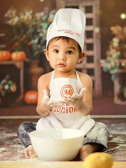 Let's get creative and messy! Our 'Little Master Chef' themed photoshoot is perfect for capturing your child's playful personality, complete with a chef's hat, apron, and a whole lot of flour.
