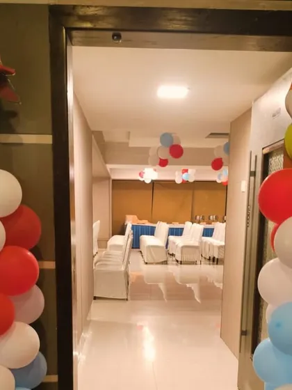 The entrance to the Paw Patrol party, featuring balloon pillars topped with character cutouts of Marshall and Rubble, welcoming the little guests.