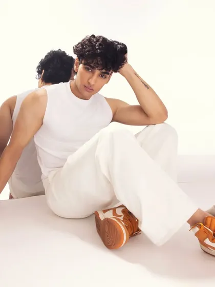 A more casual, relaxed look. The makeup is minimal, focusing on evening out the skin tone and keeping him looking fresh.