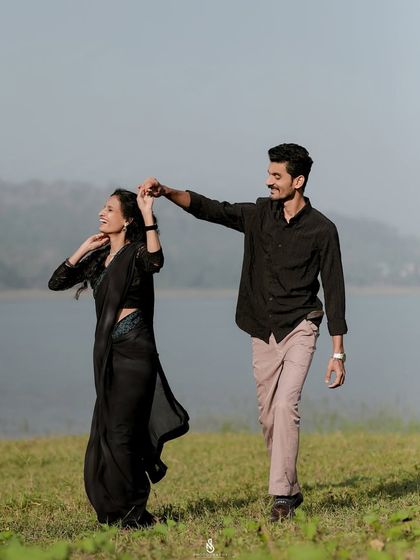 A graceful dance by the lakeside. The movement and connection between the couple make for a dynamic and beautiful photograph.