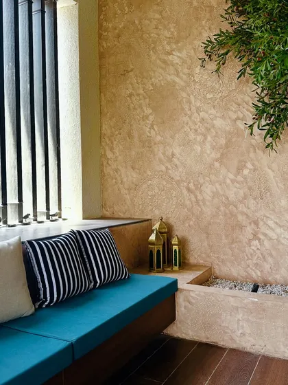 A closer look at the built-in planter for the tree, showing how it is seamlessly integrated into the balcony's design.
