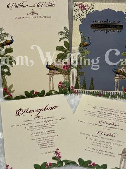 This image shows the full suite of the peacock-themed invitation, including the hardback cover and the matching inserts for the reception and wedding ceremony.