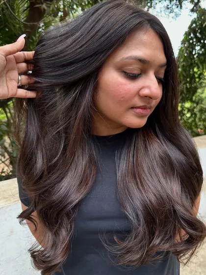 Her first hair color, and we went with a beautiful 'Cocoa Bean' shade. This is a great choice for a first-timer, as it's a subtle, rich brown that enhances natural hair color without being too dramatic.
