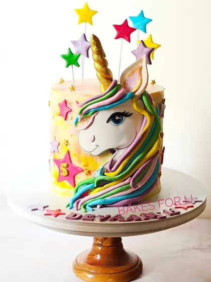 A magical 3D unicorn cake with a colorful mane and a golden horn. This sculpted design is a true centerpiece and a dream come true for any unicorn lover.
