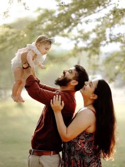 The pure delight of a father lifting his baby girl into the air during a golden hour outdoor shoot. We focus on creating a playful atmosphere where these energetic and loving moments can happen naturally.