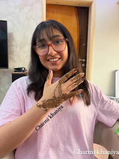 A happy client with her simple and stunning jewellery-style mehendi. It's a perfect blend of tradition and creativity.