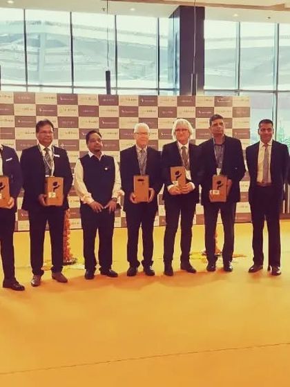 A group photo of the esteemed panel at the inauguration, ready to open the show for business.