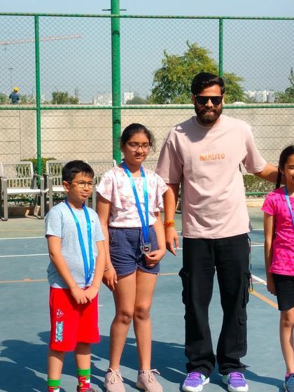 Posing with some of the talented young athletes who participated in the Inter-Society basketball matches. I ensure both boys and girls get equal opportunities to compete.