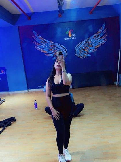 A moment of pride captured in the studio mirror. Our space is designed to make you feel empowered and motivated on your fitness journey.