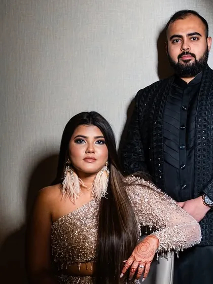 A powerful couple portrait. Kajol's makeup for her cocktail event was bold and confident, with a focus on sharp contouring and a defined eye.