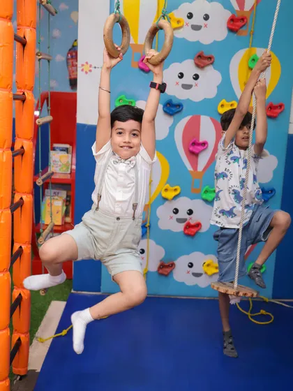 Building strength and confidence is part of the fun. Our kid-friendly climbing wall and gymnastic rings offer a safe challenge for aspiring adventurers, helping develop motor skills and coordination.