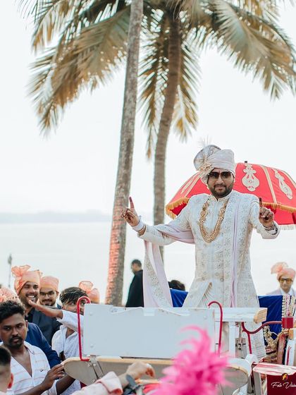 The groom's grand entrance on a beautifully decorated cart for a beachside baraat in Goa. We ensure the groom's procession is captured with all its energy and style.