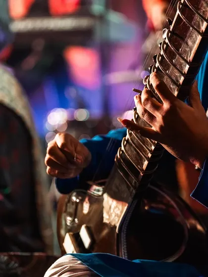 A moment captured during a live performance. The connection between the artist, the instrument, and the music is a sacred space.