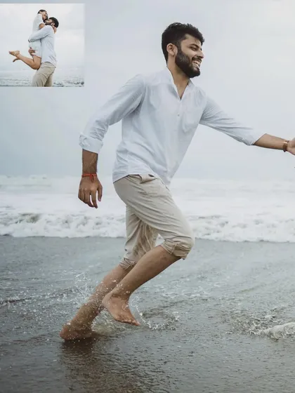 A playful moment from a Goa pre-wedding shoot, with the groom running in the surf.