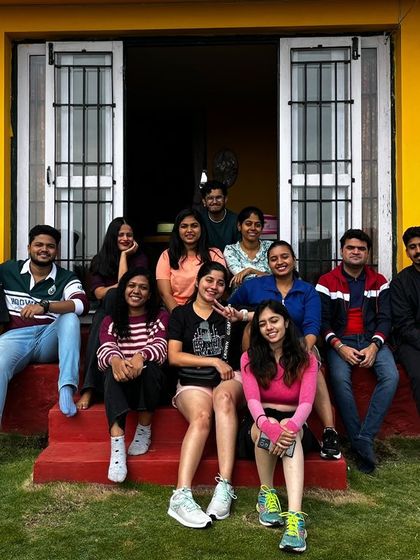 A happy group from another batch posing at our popular yellow homestay.