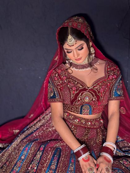 A candid shot of the bride, showing how the hairstyle and makeup look from different angles. The soft front tendrils frame the face beautifully.