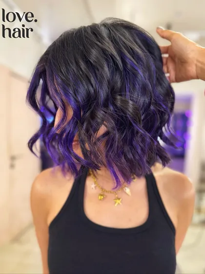 The back view of this purple peekaboo bob, showing how the color is subtly woven into the dark base.