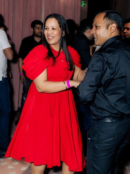 The pure joy of dancing. This couple is all smiles during our Salsa Night, showing that you don't need to be a pro to have a fantastic time on the dance floor.