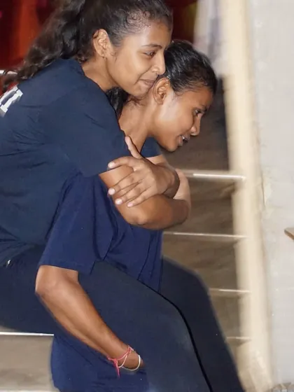 Teamwork makes the dream work. Students helping each other during a strength and conditioning drill.