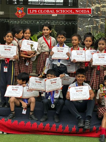 Our young gymnasts proudly display their medals and certificates from the 'AAHWAN 2024' Inter-School Sports Carnival. Their success across multiple events is a result of their rigorous training and passion for the sport.