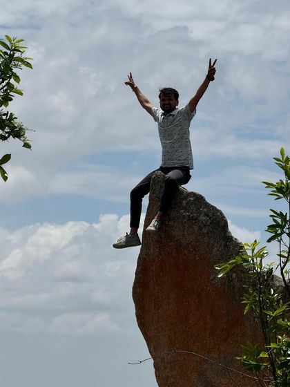 That feeling of being on top of the world. A triumphant moment for a trekker at the summit of Uttari Betta.