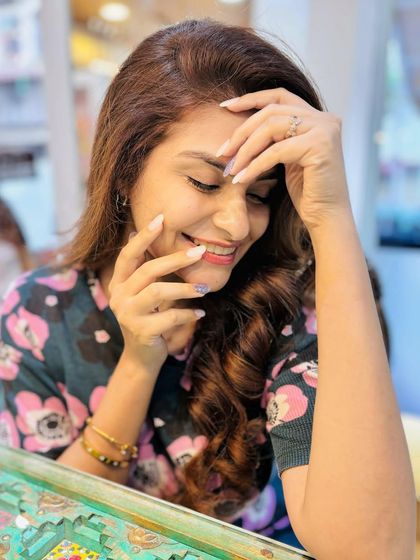 A candid shot of the actress enjoying her fresh dip manicure. A great set of nails is the perfect reason to smile.