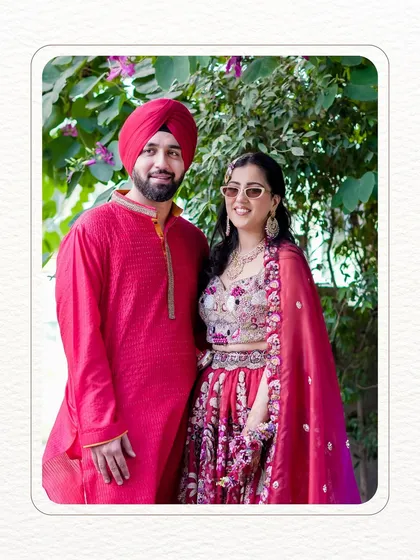 A classic portrait of the couple during their "Shagna di Mehndi." Their happy smiles and coordinated outfits capture the festive spirit of the day.