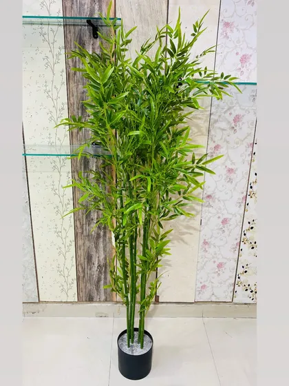 A tall and slender artificial bamboo plant, perfect for creating a sense of calm and tranquility in office spaces or waiting rooms.