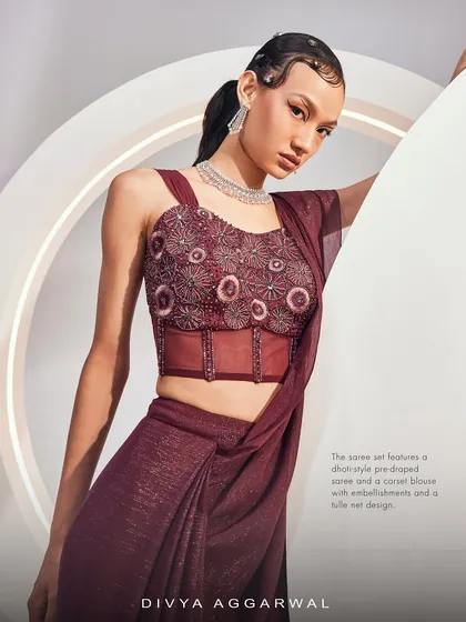 A closer look at the Isla Saree Set's corset blouse, featuring intricate embellishments and a modern tulle net design for a stunning effect.