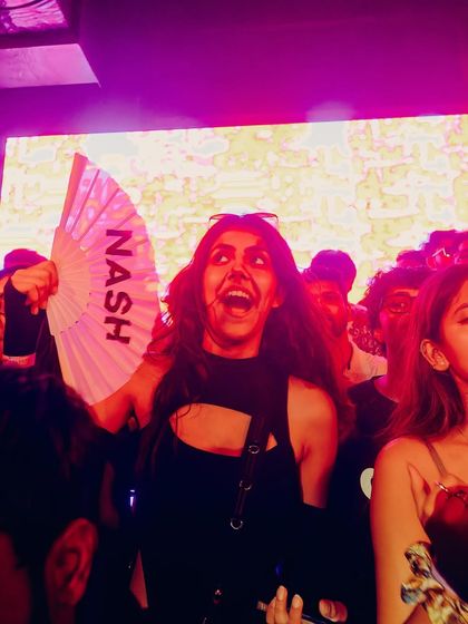 The best kind of support. A fan in the crowd with a custom "NASH" fan.