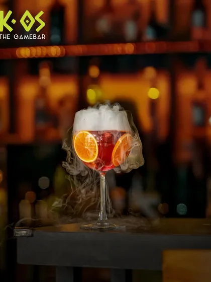 Our cocktails are as dramatic as our weekend plans. This smoky, citrus-infused creation is just a preview of the magic our bartenders mix up every night.